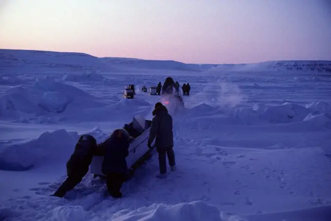 CANADA, NUNAVUT,  FROZEN BARROW STRAIT, TOURISTS ON SKIDOO EXPEDITION