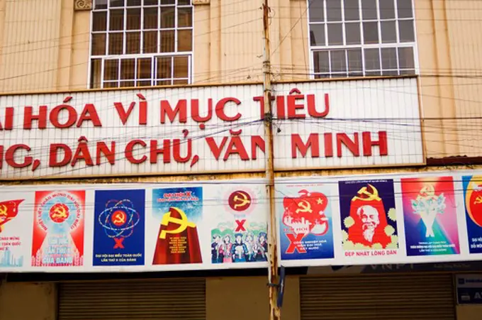 NORTH VIETNAM, HANOI, OLD FRENCH QUARTER, STREET SCENE, COMMUNIST POSTERS AND SLOGANS