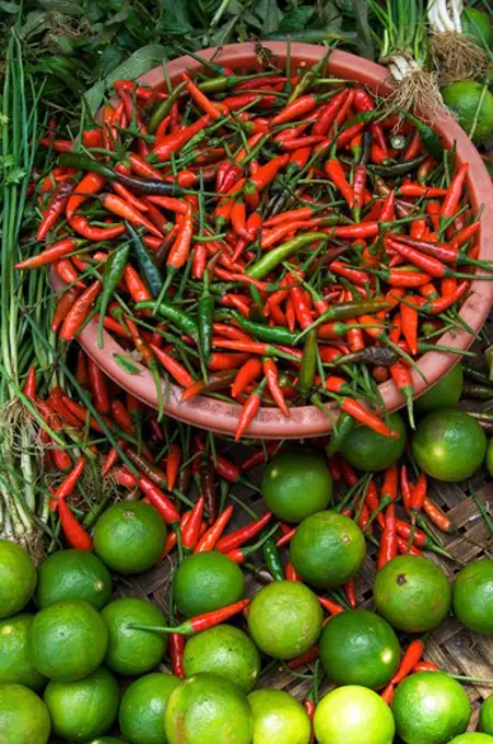 VIETNAM, HUE, MARKET, CHILI PEPPERS AND LIME