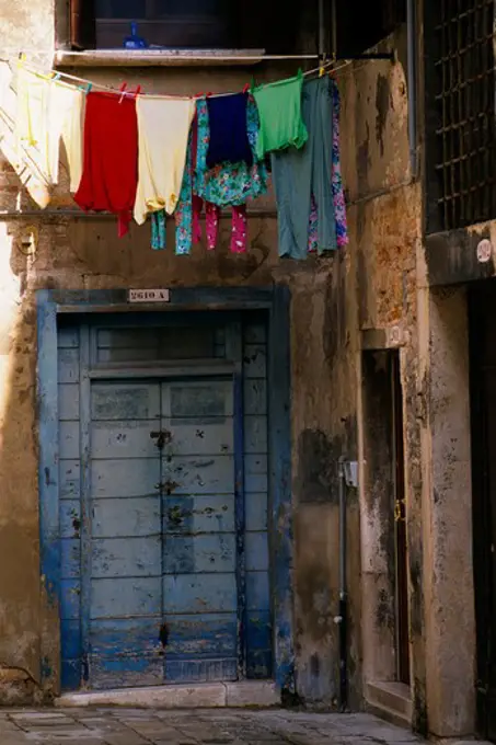 ITALY, VENICE, DOOR WITH LAUNDRY