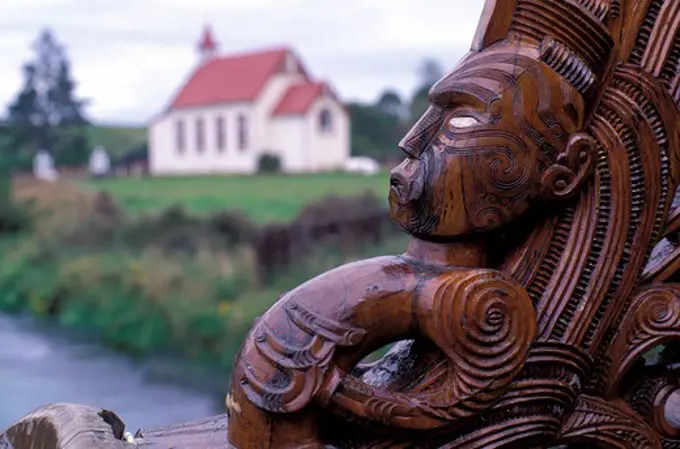 NEW ZEALAND, NEAR ROTORUA, DETAIL OF CARVED CANOE