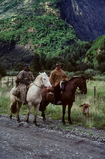 CHILE, (SOUTHERN CHILE) GAUCHOS ON HORSEBACK