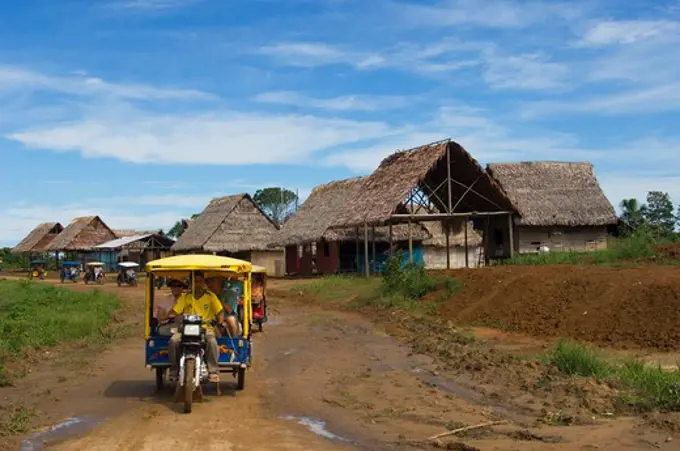 PERU, AMAZON RIVER BASIN, NEAR IQUITOS, MARANON RIVER, TOWN OF NAUTA, STREET SCENE, TOURISTS RIDING IN MOTORBIKE TAXI