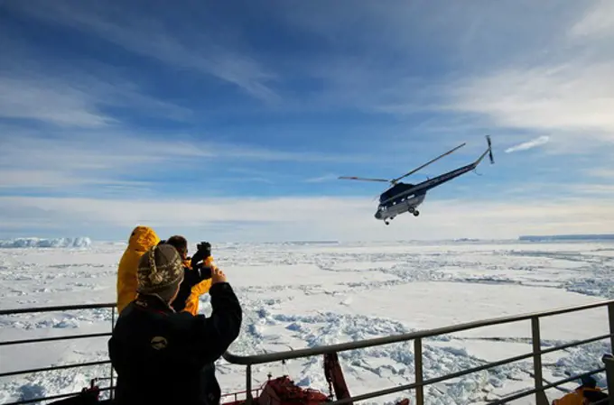 ANTARCTICA, WEDDELL SEA, ICEBREAKER KAPITAN KHLEBNIKOV, TOURISTS WATCHING HELICOPTER