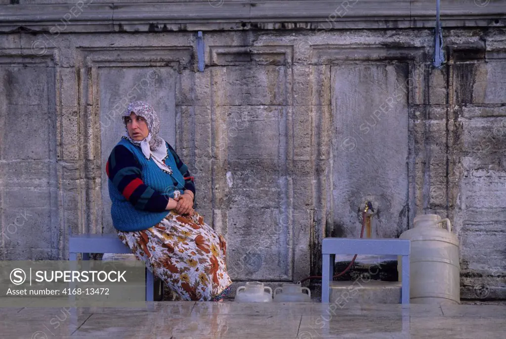 Turkey, Istanbul, Suleymaniye Mosque, Woman Getting Water