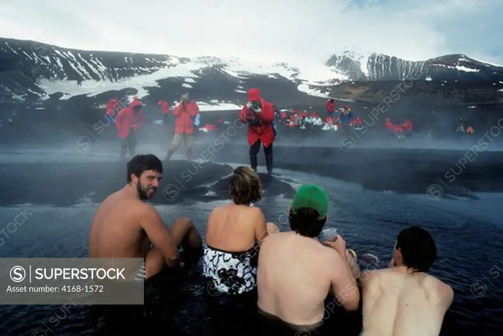 ANTARCTICA, DECEPTION ISL. TOURISTS BATHING IN HOT SPRINGS