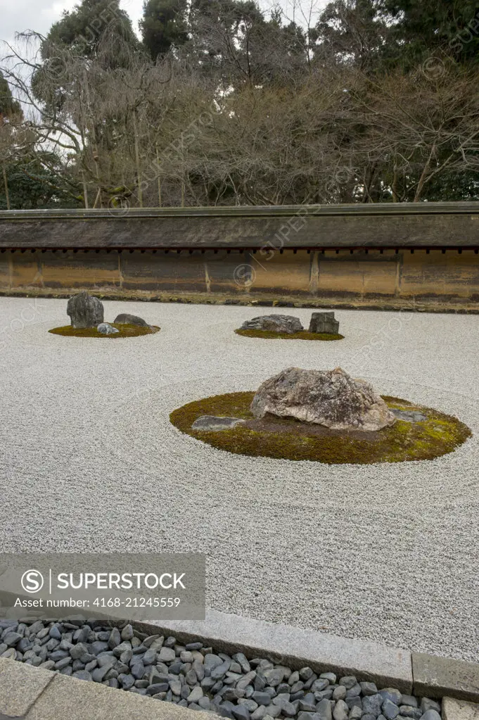 The kare-sansui (dry landscape) Zen rock garden at Ryoan-ji Temple in Kyoto, Japan.