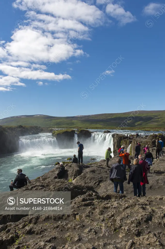 People at the the Godafoss waterfall (Skjalfandafljot River) in Northeast Iceland.