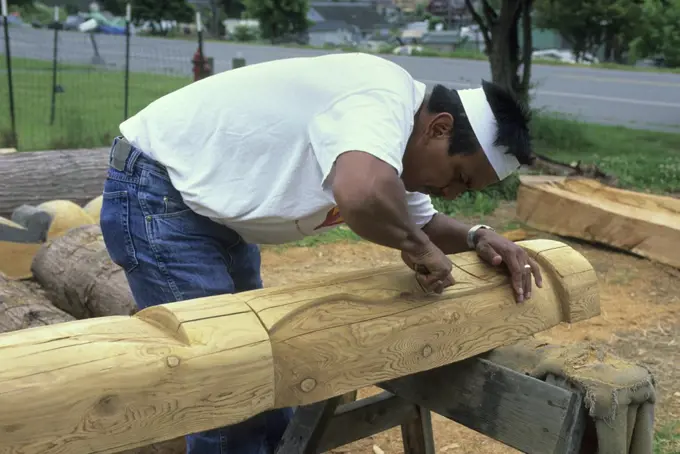 USA,Washington, Near La Conner, Swinomish Indian Reservation, Native American Wood Carver Kevin Paul Working On Totem Pole