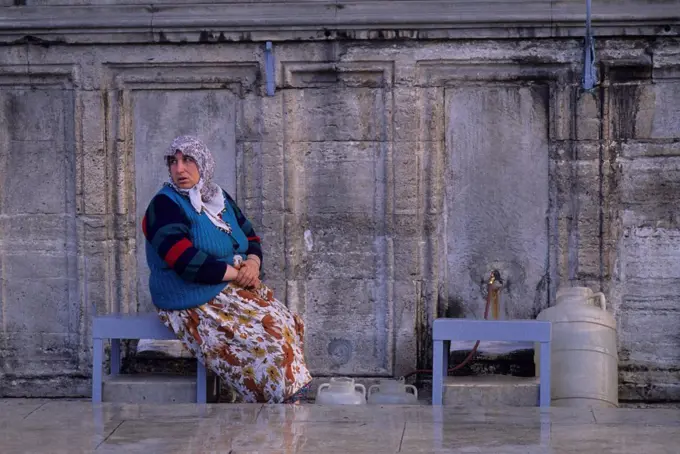 Turkey, Istanbul, Suleymaniye Mosque, Woman Getting Water