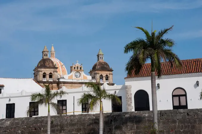 City Wall Of The Old Walled City Of Cartagena, Colombia With San Pedro Claver Church In Background