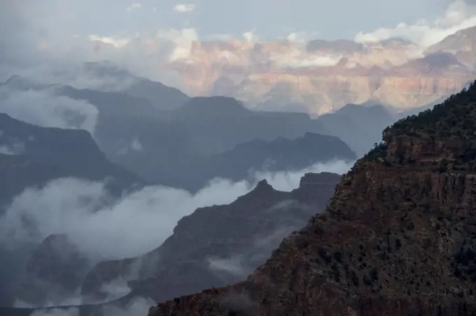 View of the Grand Canyon from Mather Point on the South Rim with clouds rising after a thunderstorm near the Grand Canyon Visitor Center in the Grand Canyon National Park in northern Arizona, USA.