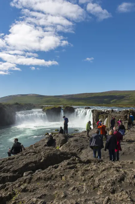 People at the the Godafoss waterfall (Skjalfandafljot River) in Northeast Iceland.