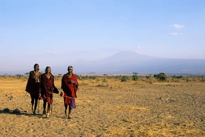 Kenya, Amboseli, Masai Men, Mt. Kilimanjaro In Background