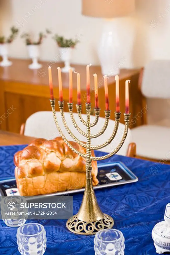 Chanukah menorah lit on table