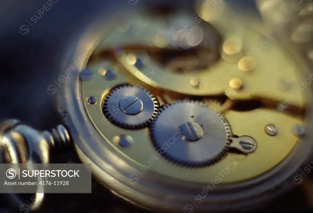 Open pocket watch showing clock mechanism