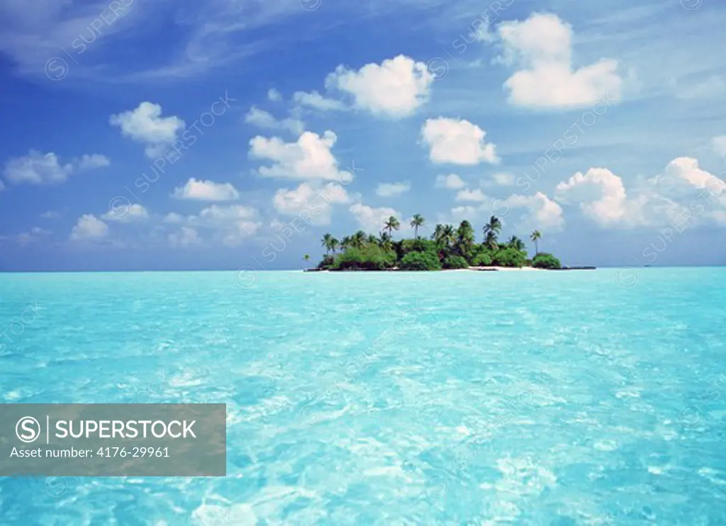 Desert Isle in the Maldives sleeping in aqua waters of the Indian Ocean