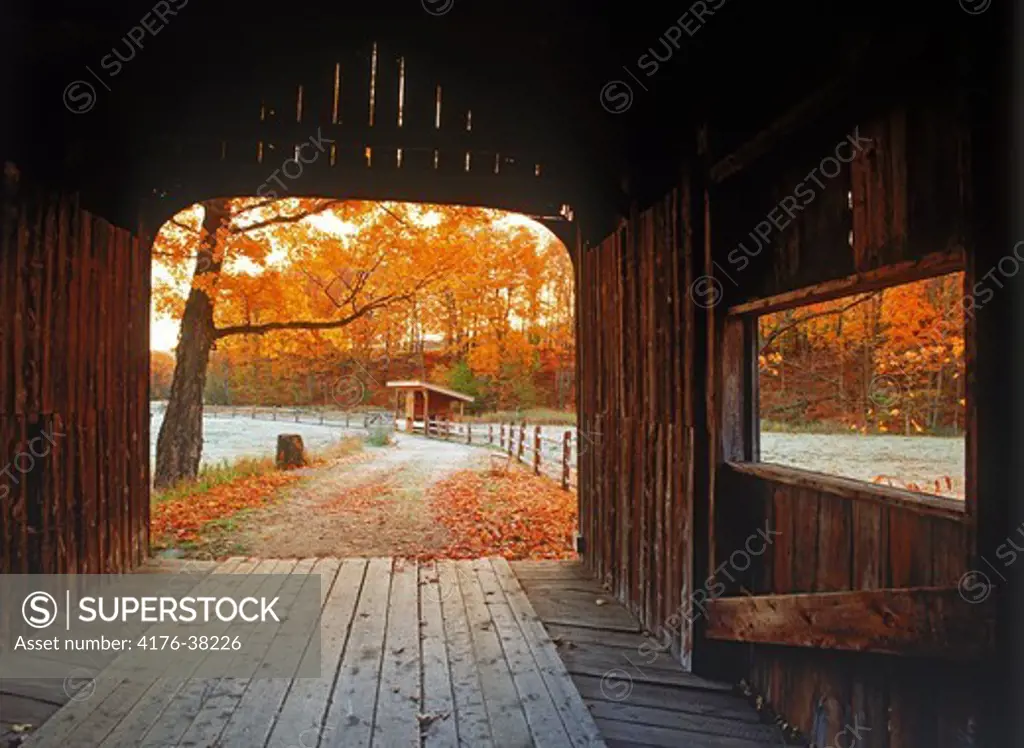 Old covered bridge amid fall foliage near Grafton, Vermont in New England, USA