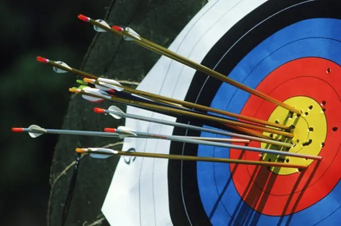 Arrows in or near the bulls eye of target during Olympic archery competition