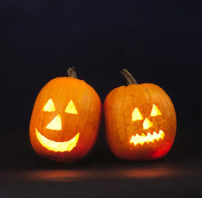 Two burning Halloween pumpkins