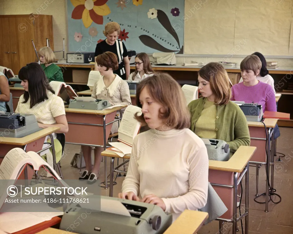 1960s ALL GIRL HIGH SCHOOL TYPING CLASS TYPEWRITERS DESKS TYPING TEACHER WOMAN FUTURE SECRETARIES SEXIST GENDER BIAS