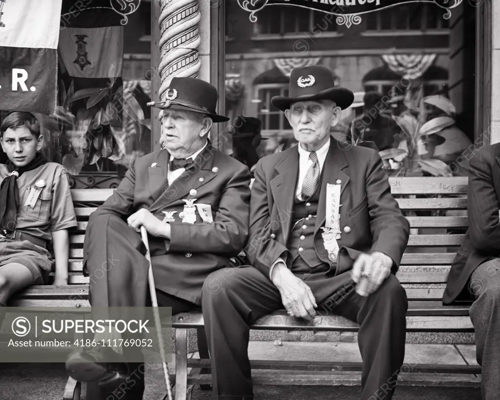 1920s TWO GAR AMERICAN CIVIL WAR VETERANS FROM KANSAS AT PARADE SITTING NEXT TO YOUNG BOY SCOUT IN ROCHESTER NEW YORK USA