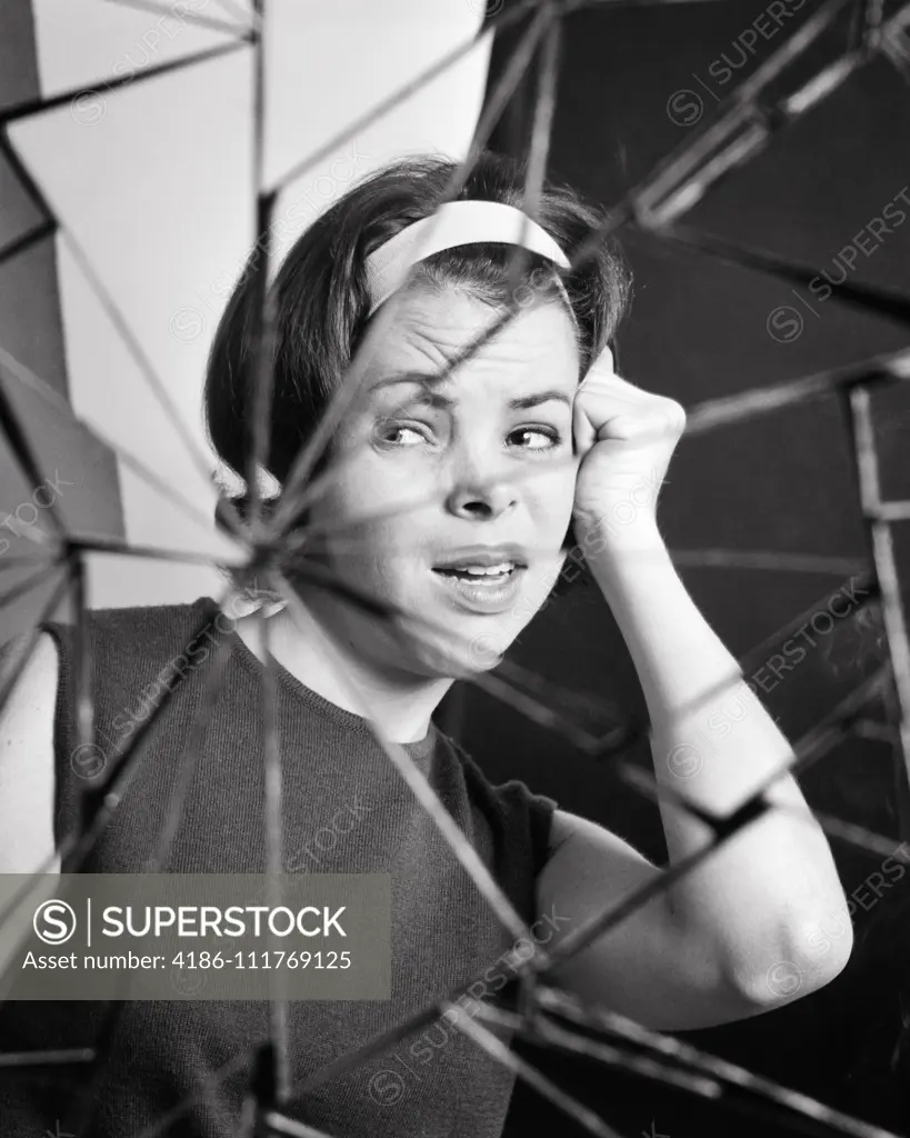 1960s COMPOSITE IMAGE UPSET WOMAN BROKEN MIRROR