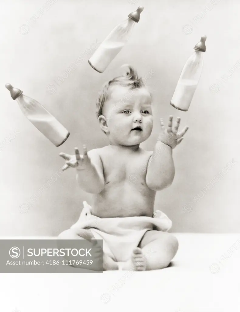 1930s BABY WEARING CLOTH DIAPER SITTING JUGGLING THREE GLASS BABY BOTTLES OF MILK