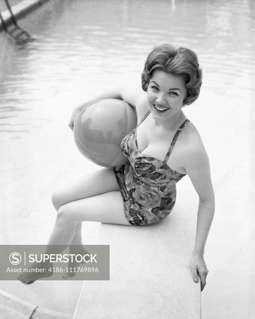 1950s BATHING BEAUTY IN SATIN ONE PIECE SITTING ON DIVING BOARD