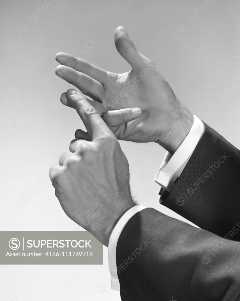 1950s 1960s MAN COUNTING ENUMERATING ITEMS ON HIS FINGERS ONE BY ONE