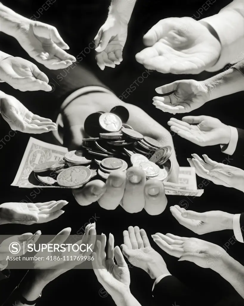 1960s MALE HAND HOLDING COINS AND DOLLARS IN CENTER SURROUNDED  BY HANDS MEN WOMEN LOOKING FOR HANDOUT ASKING FOR MONEY BEGGING