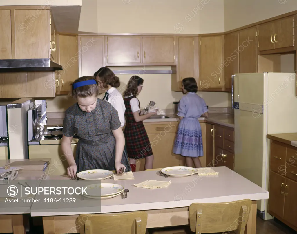 1960S 4 Girls Students In Kitchen Home Economics Class Setting Table Cooking Education