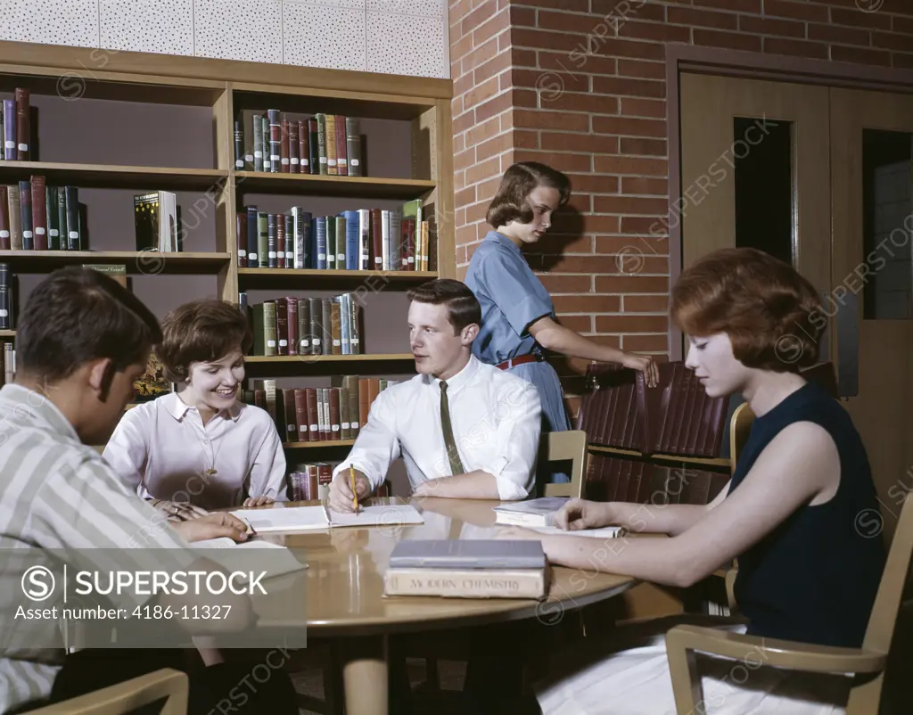 1960S 5 Students Round Table In Library High School Study Teens Boys Girls Group