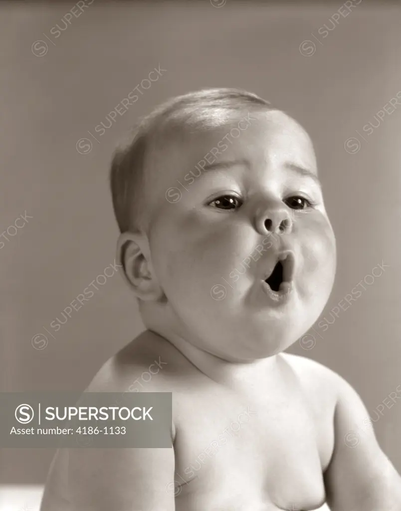 1960S Portrait Baby With Chubby Cheeks Making O Shape With Mouth