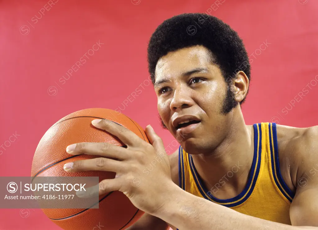 1970S African American Man Athlete Basketball Player With Long Sideburns About To Pass Ball