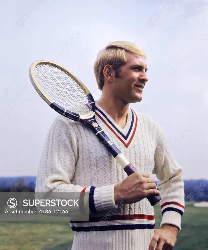 1970S Smiling Blond Man Wearing Cable Knit Sweater Holding Tennis Racket Over Shoulder