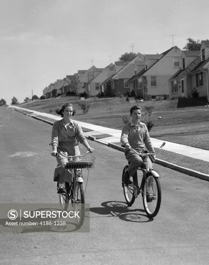 1950S Teen Boy Girl Riding Bikes Suburban Neighborhood Street