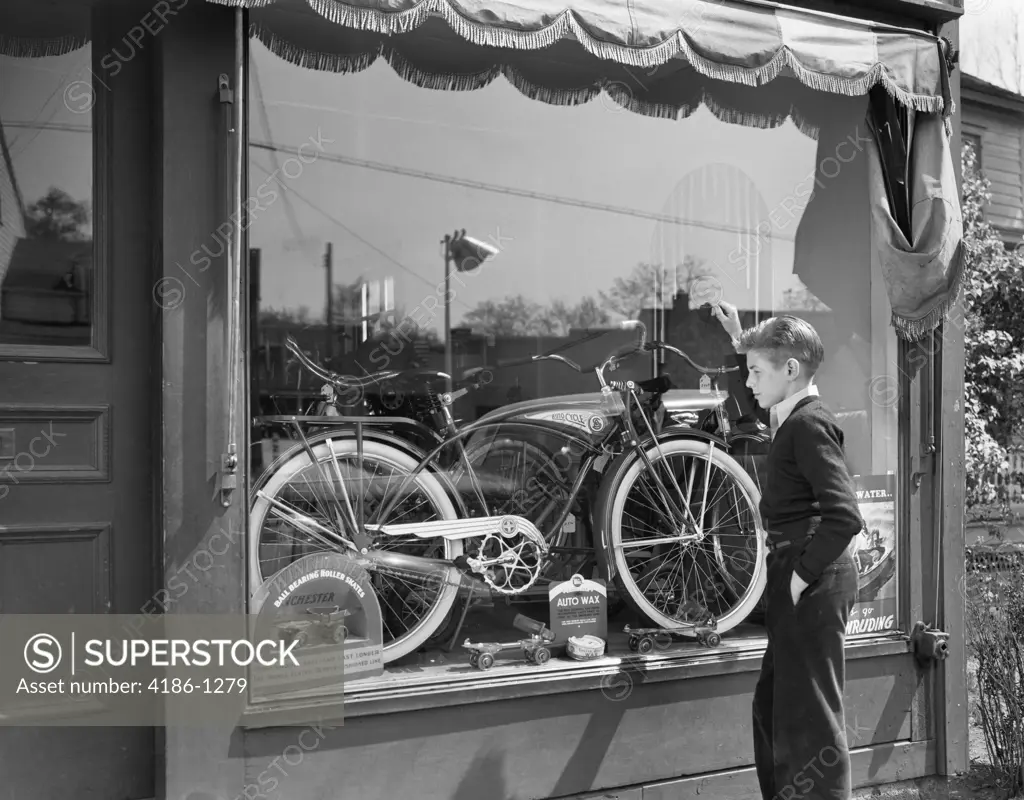 1950S Boy On Sidewalk Looking At Bicycle In Store Window