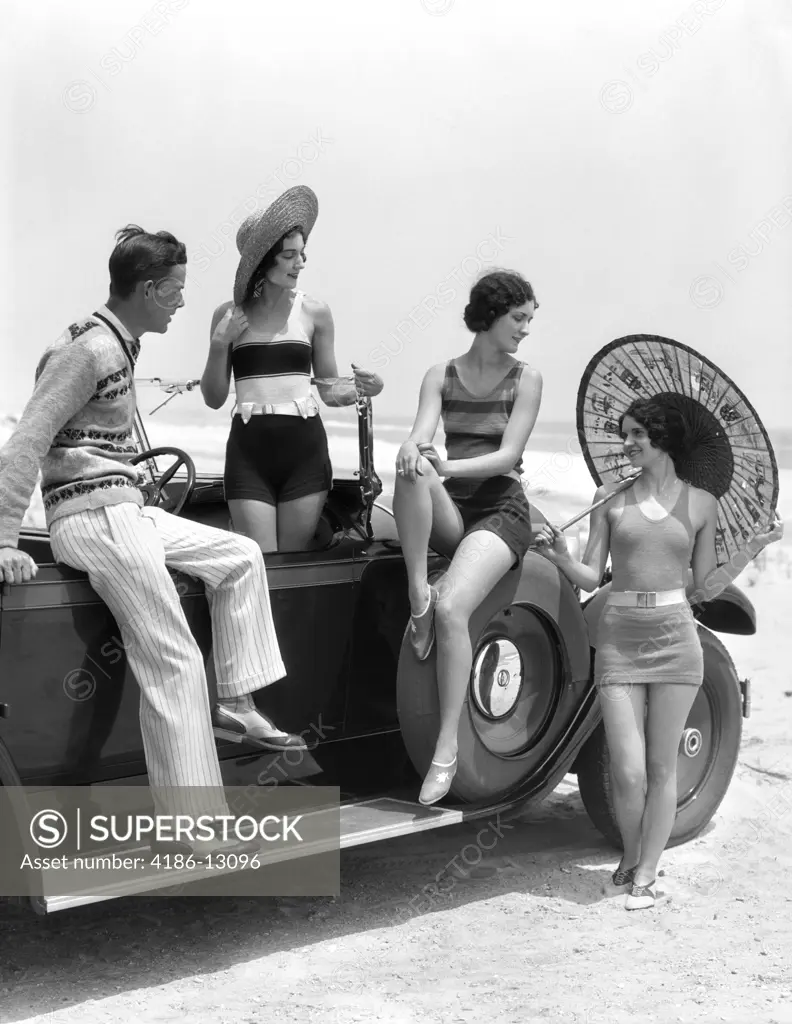 1920S 1930S Man And Three Women In Beach Clothes Or Bathing Suits Posing With Car On Running Board