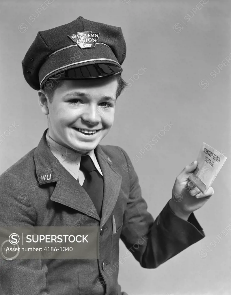 1920S 1930S 1940S Smiling Boy Wearing A Western Union Uniform And Hat Holding A Telegram