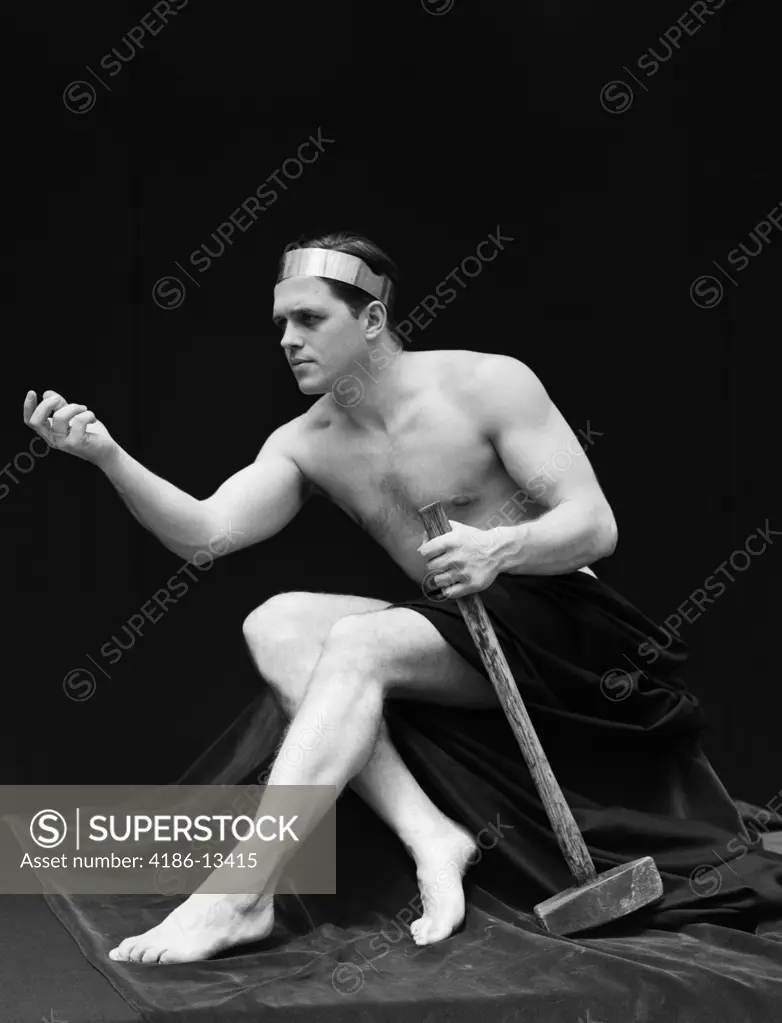 1920S Man Semi Nude Classical Pose Sitting Holds Long Armed Hammer Wearing  Headband Retro Vintage - SuperStock