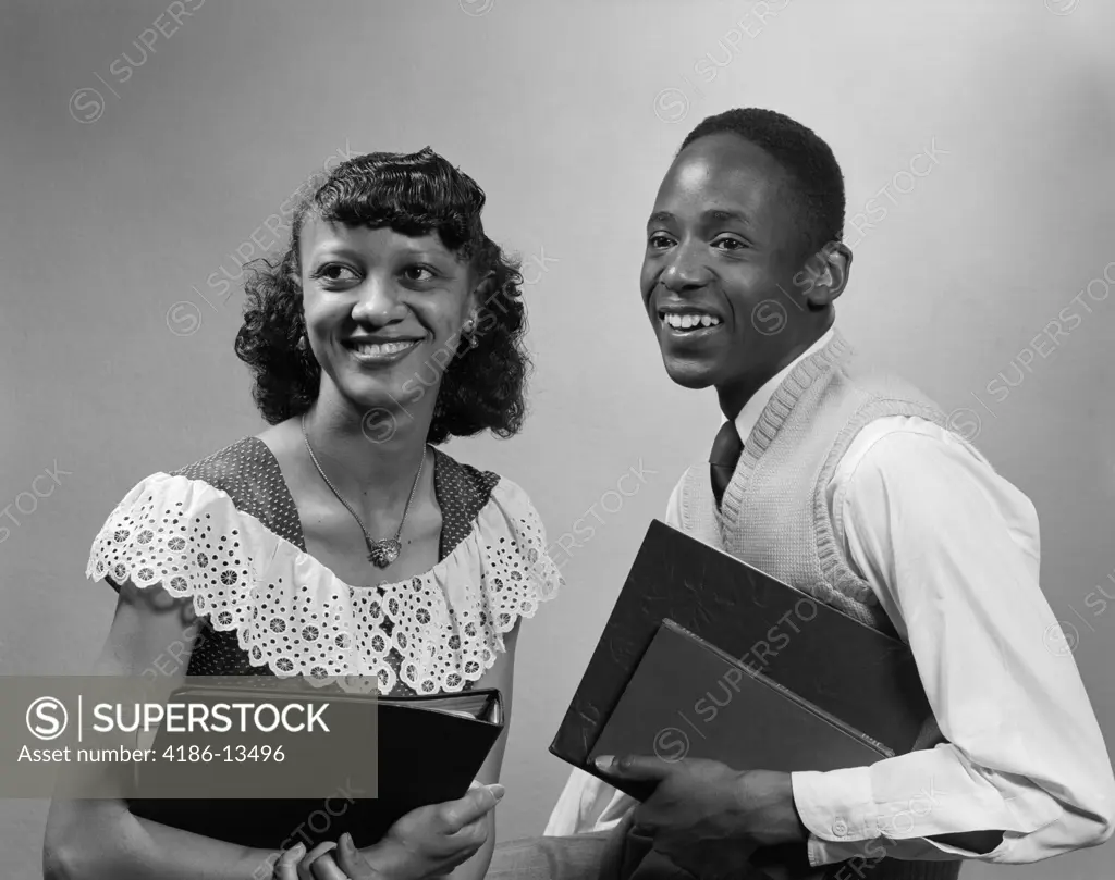 1950S Two Smiling African American Students Boy Girl Carrying Books Couple