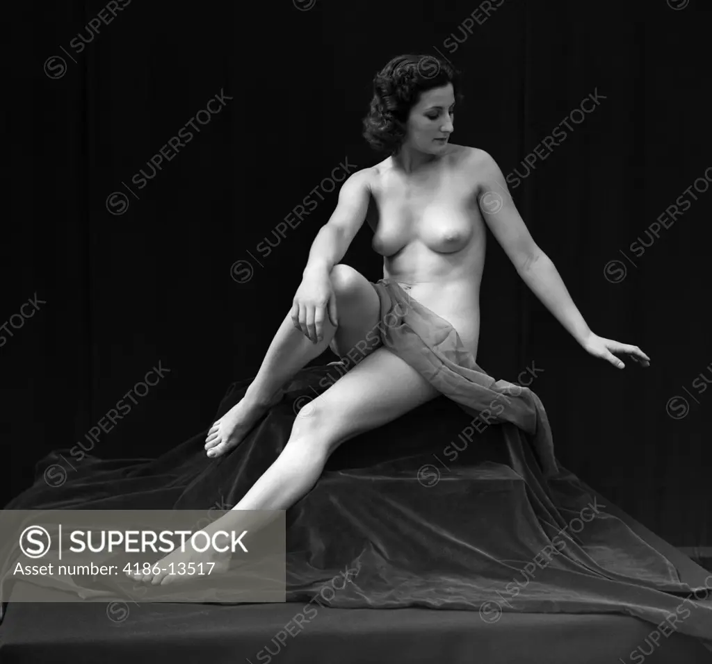 1920S Nude Woman Classic Pose Sitting Cloth Draped Across Waist - SuperStock