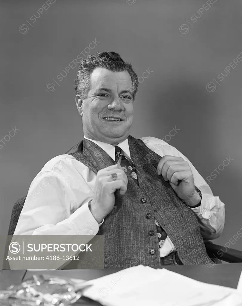 1940S Man In Suit Sitting At Desk Smiling