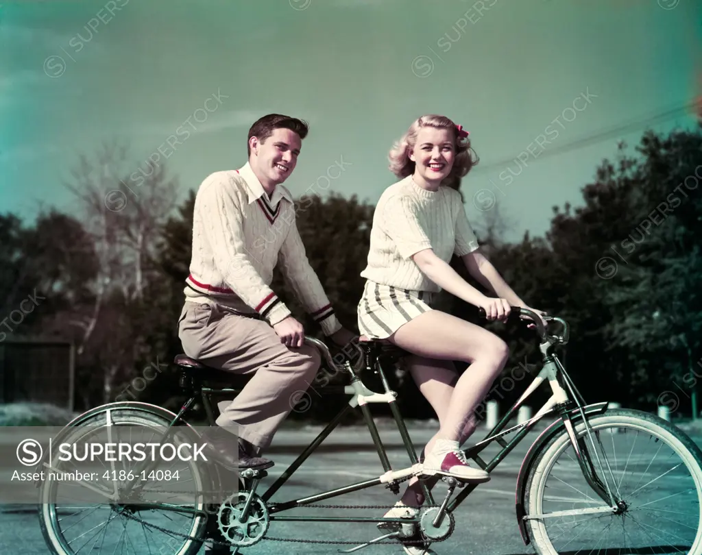 1950S Smiling  Couple Riding Tandem Bicycle Built For Two