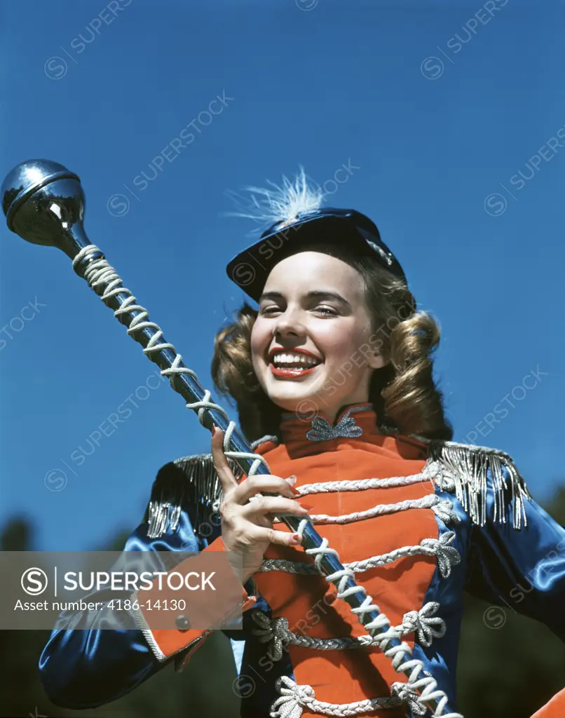 1940S 1950S Smiling Teen Girl Majorette Drum Major In Uniform Holding A Baton Staff