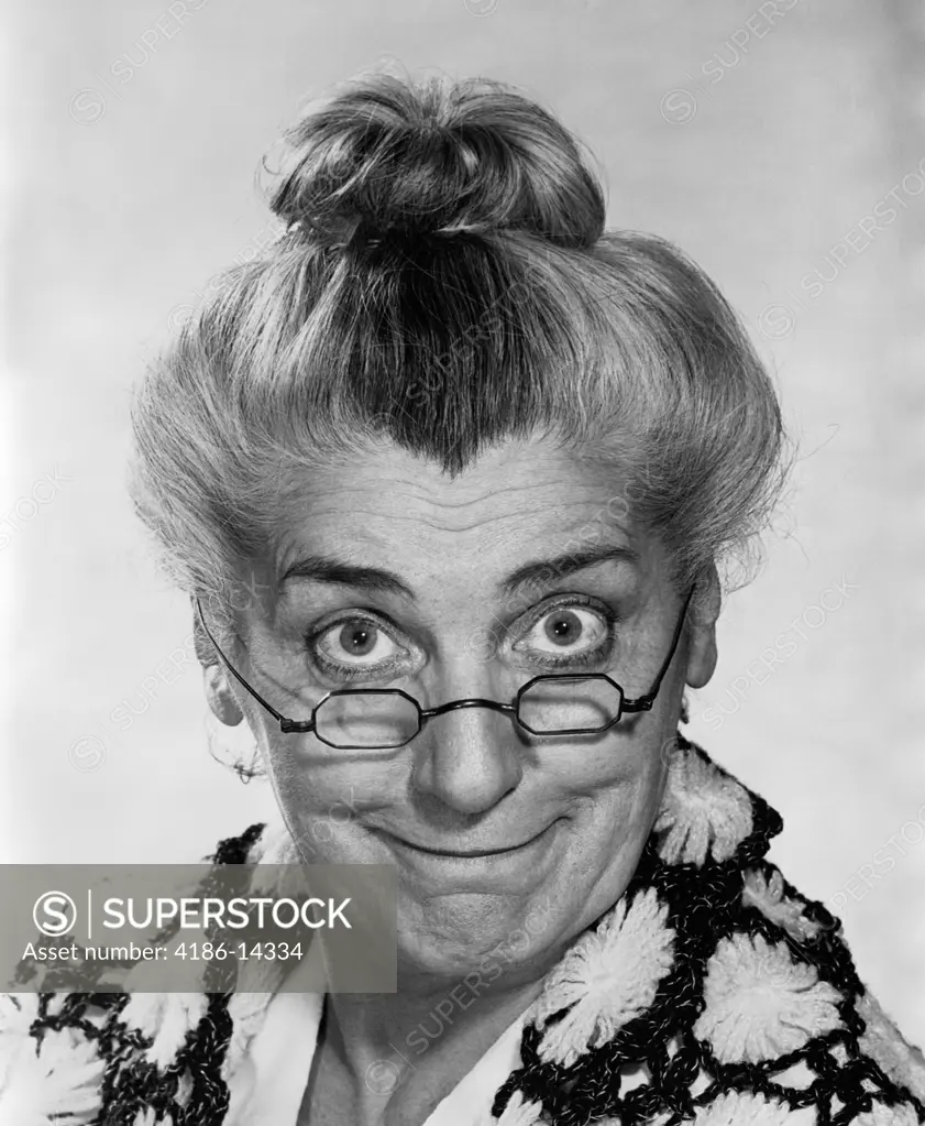 1970S Portrait Elderly Woman With Hair In Bun Wearing Granny Glasses Smiling