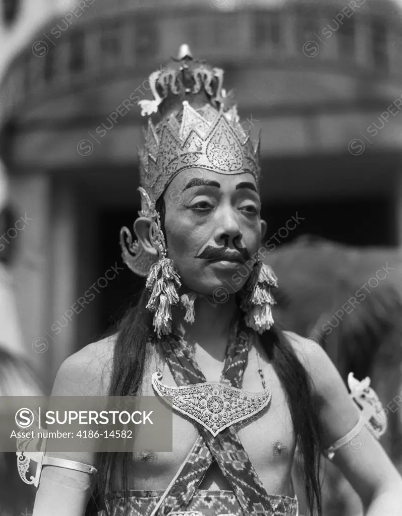 1920S 1930S Man Male Javanese Dancer In Costume Portrait Crown Earrings Makeup Fake Moustache Eyebrows Java Indonesia