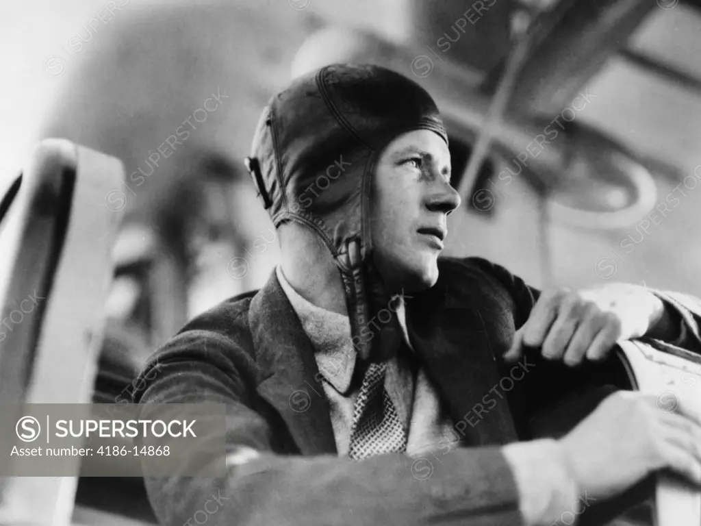 1920S Close-Up Of Charles Lindberg In Leather Aviator Cap Sitting In Cockpit Of Plane