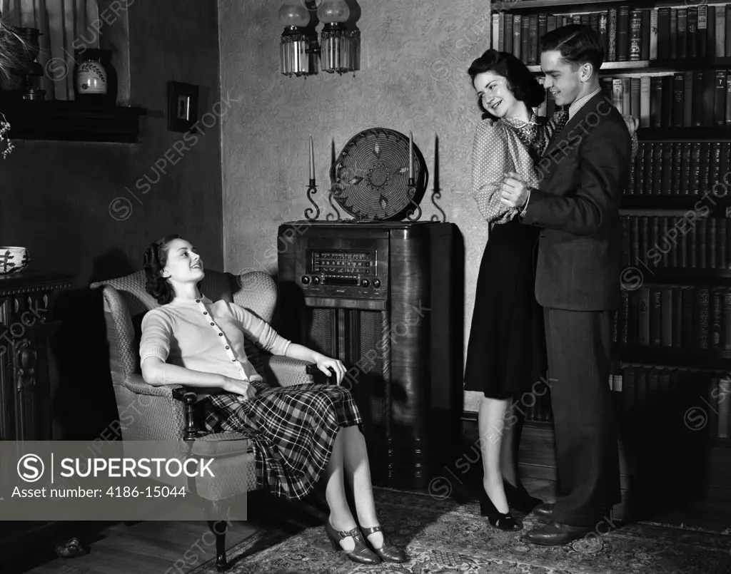 1940S Young Teenage Couple Dancing To Radio Woman Sitting In Chair